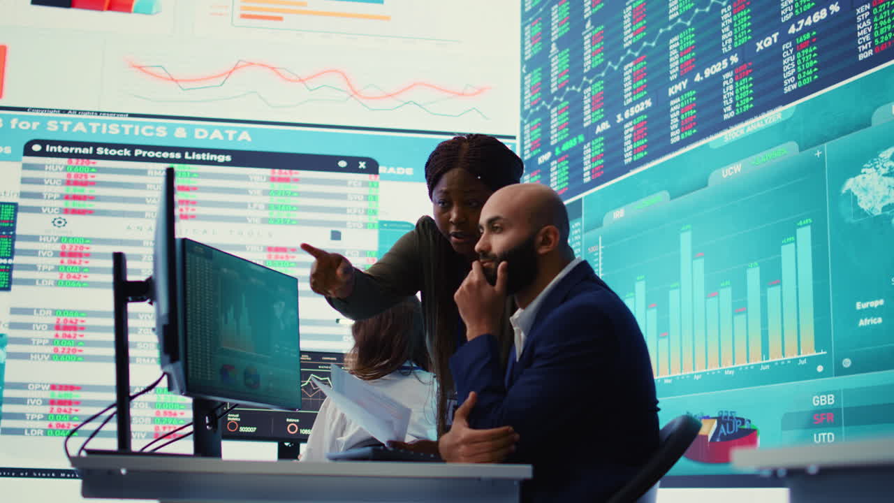 Diverse business analysts working to evaluate costs and create a projection