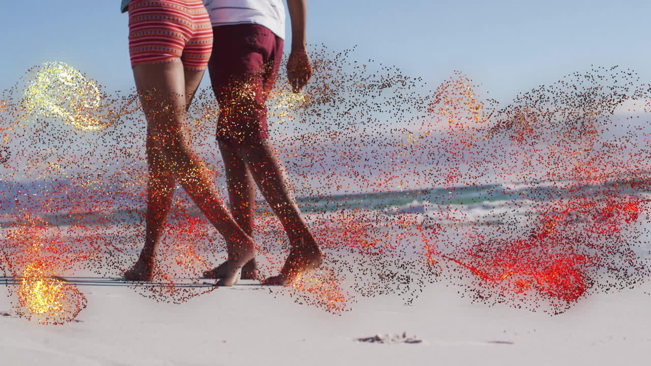 Couple walking barefoot on sandy shore, with animated step counter and heart icon showing health