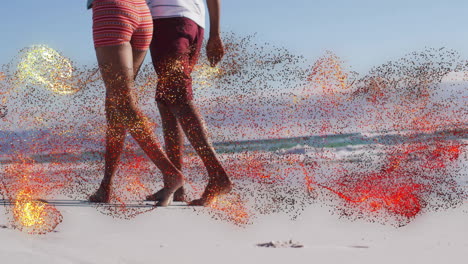 couple walking barefoot on sandy shore, with animated step counter and heart icon showing health