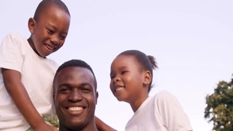 Happy-man-holding-his-children-