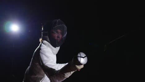 a fencer in action during a competition