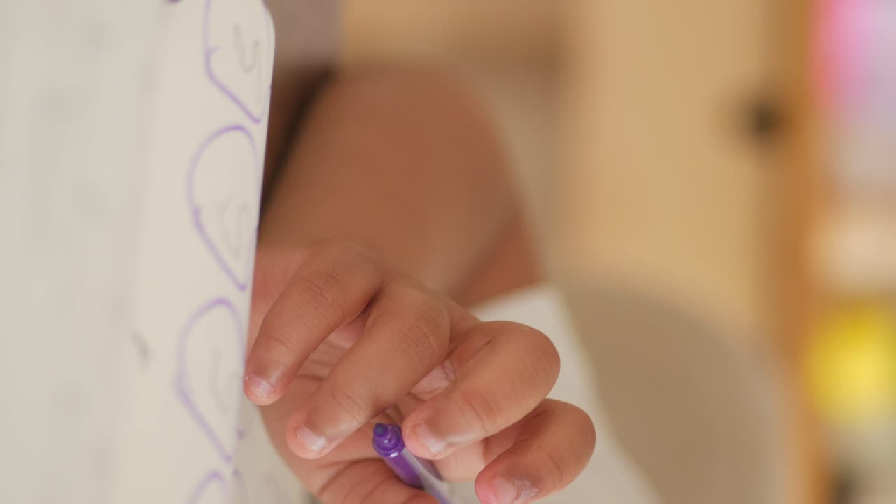 Child Learning Numbers with Markers