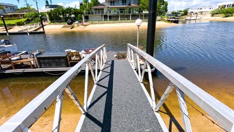 walking along a pier towards the water