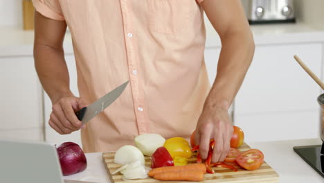 man cooking vegetables