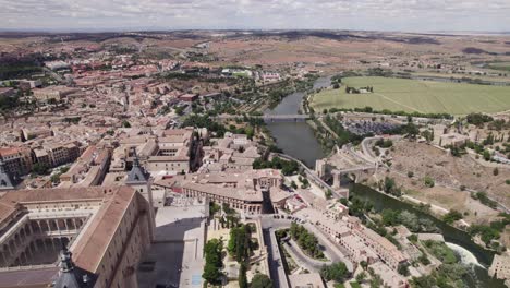 aerial flyover of alcazar de toledo, overlooking river tagus