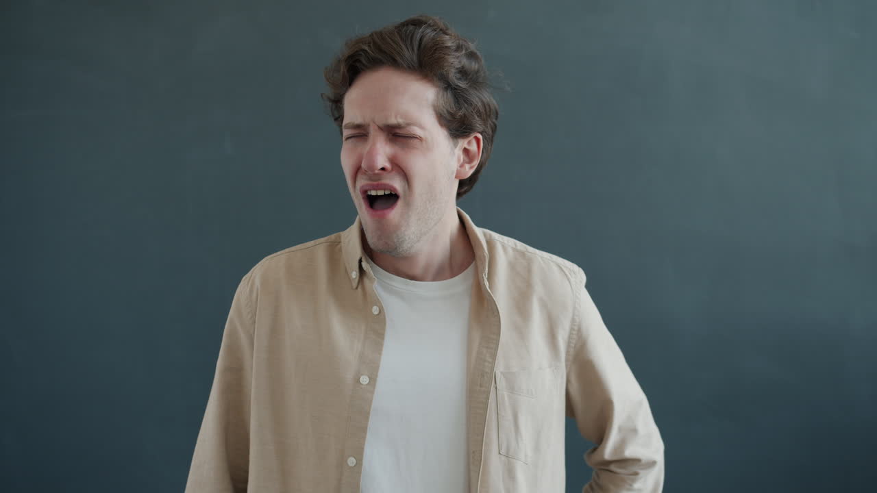 Man Yawning and Praying