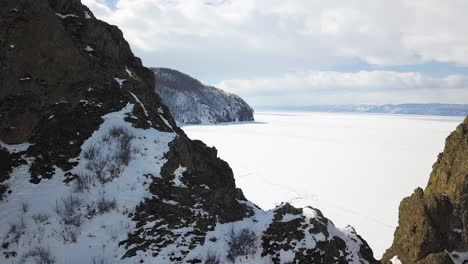 frozen lake and snowy mountains