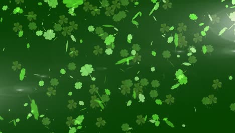 Animation-of-green-clovers-falling-on-dark-green-background-for-St.-Patricks-day