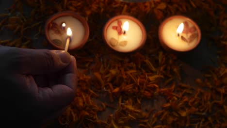 pan left across diyas or lamps lit up for diwali 'festival of light', the most important ancient hindu festival celebrated signifying victory of light over darkness