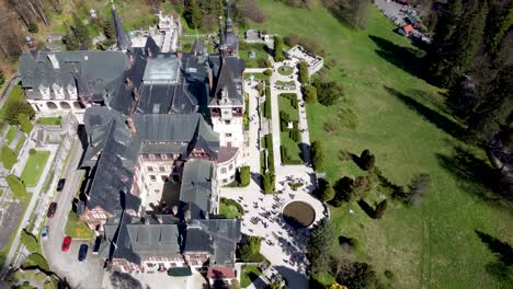 Top-aerial-view-of-impressive-Neo-Renaissance-Peles-Castle-in-Sinaia,-Romania