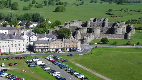 sunny touristic beaumaris castle town aerial view ancient anglesey fortress landmark fast right orbit