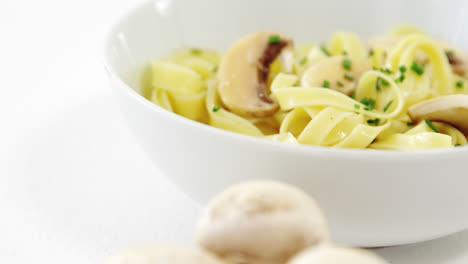 mushroom with bowl of pasta