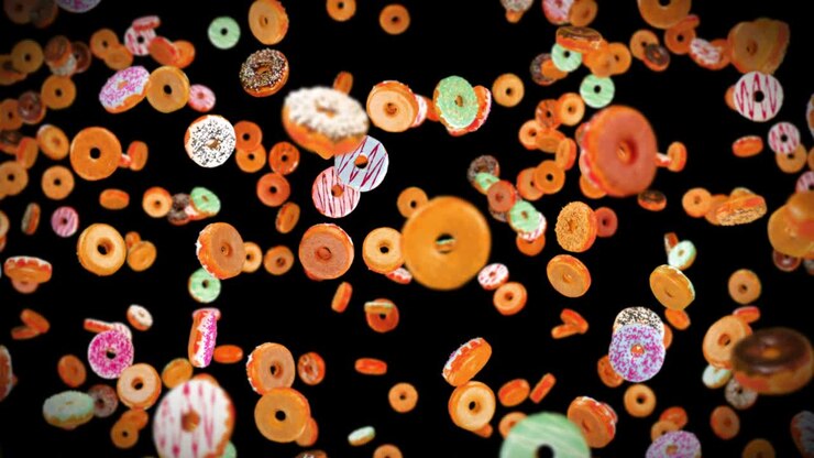Flying many colorful donuts on black background. Doughnut cake, Sweets, Dessert. 3D animation of donut rotating. Loop animation.