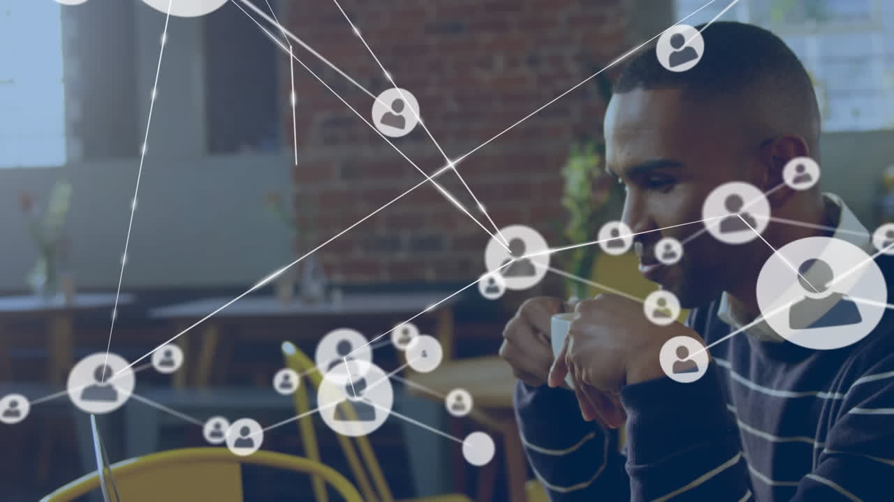 Animation of network of profile icons against biracial man drinking coffee at a cafe