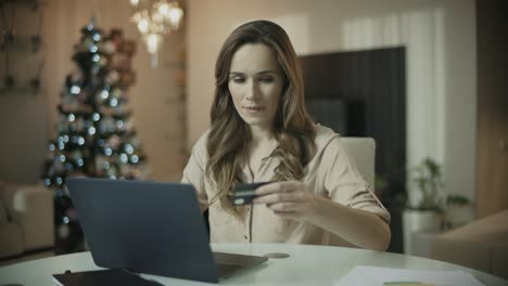 young woman shopping online at christmas time. christmas online shopping