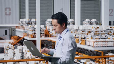 warehouse worker using laptop