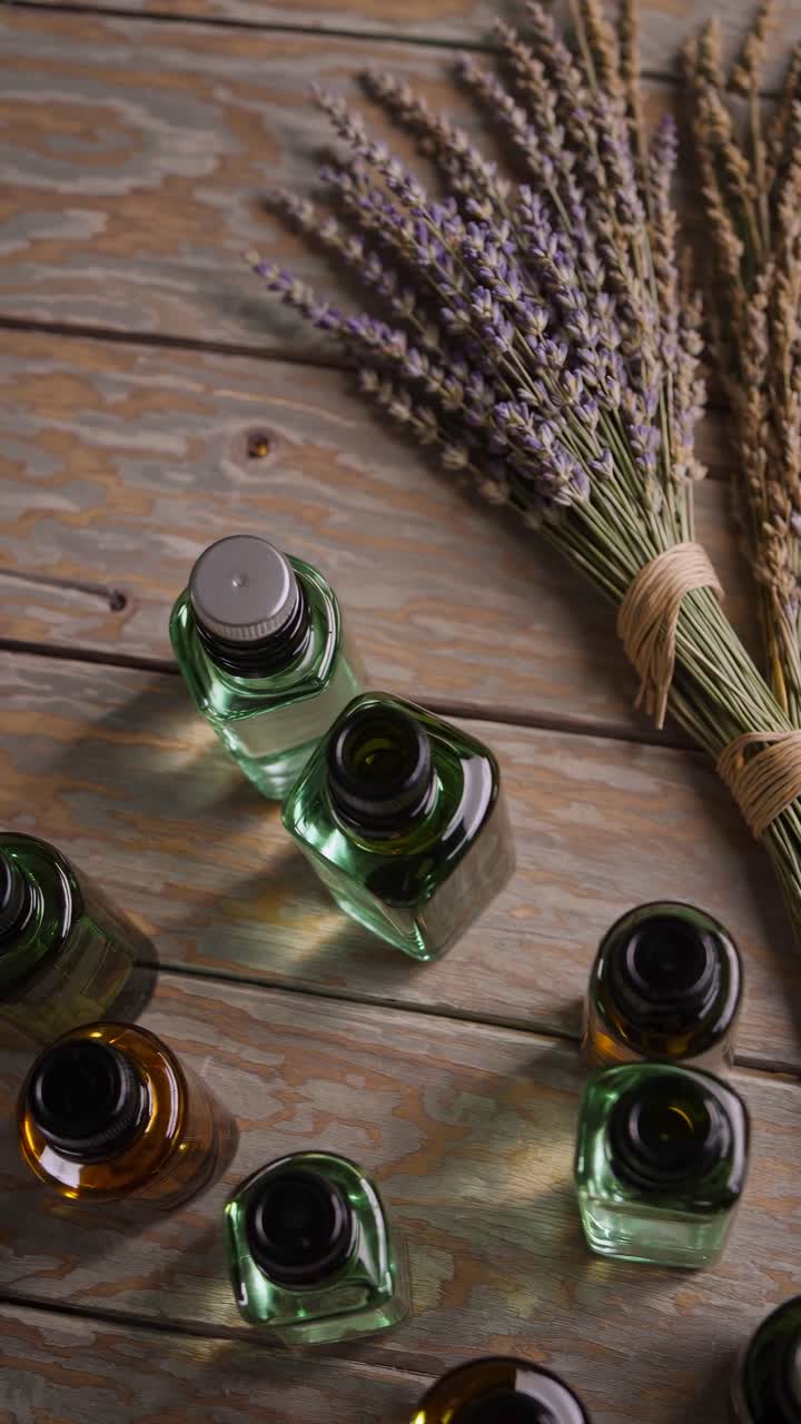 Natural Lavender and Essential Oil Bottles on Rustic Wooden Table