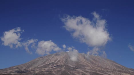 static shot of kilimanjaro with clouds moving