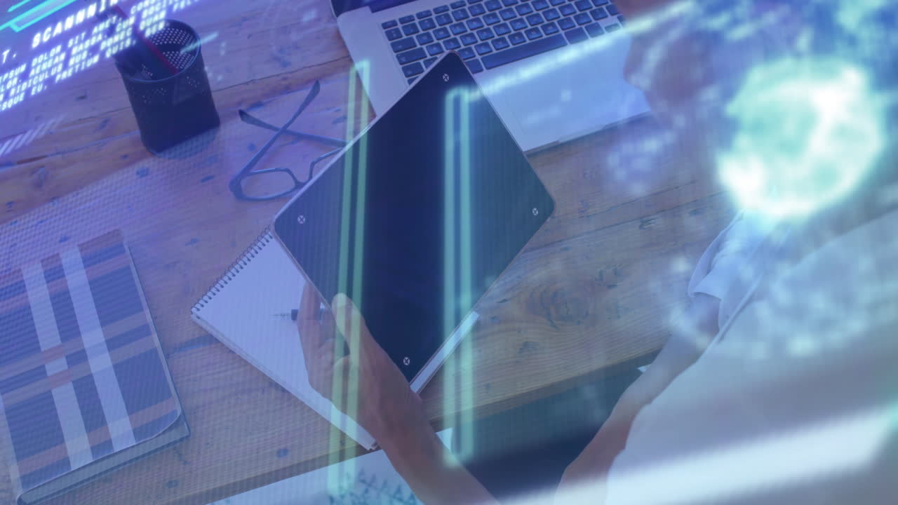 Person holding tablet with financial data animation over office desk