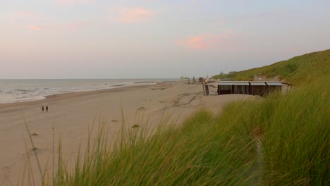 beautiful sunset at the beach with sand dunes