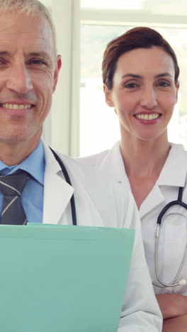 team of smiling doctors looking at camera