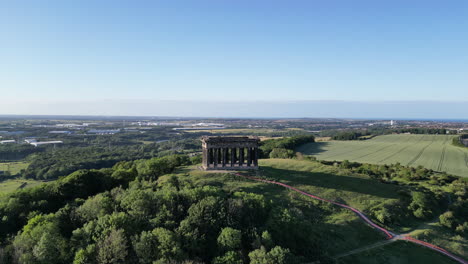 aerial wide cinematic, camera pulls back and rises up on penshaw monument in sunderland, north east, uk