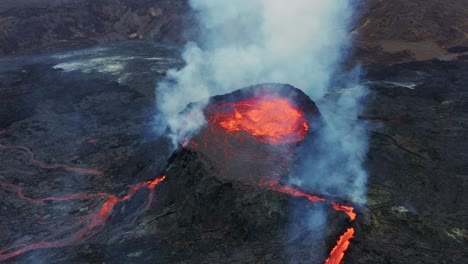 hot lava and magma boiling in the crater of fagradalsfjall volcano in iceland - orbiting drone shot