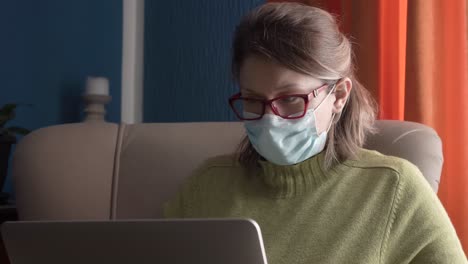 woman working on computer from home during quarantine day due to worldwide pandemic caused by virus corona
