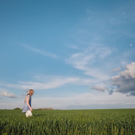 Side-View-Of-A-Girl-Walking-Along-The-Picturesque-Floor-In-The-Rays-Of-The-Setting-Sun