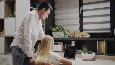 study at home - cat and older brother help girl with homework