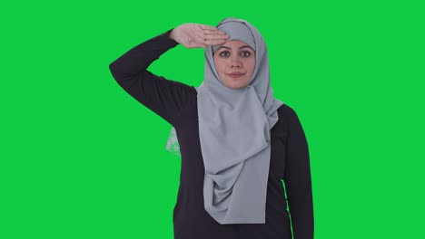 proud muslim woman saluting on camera green screen