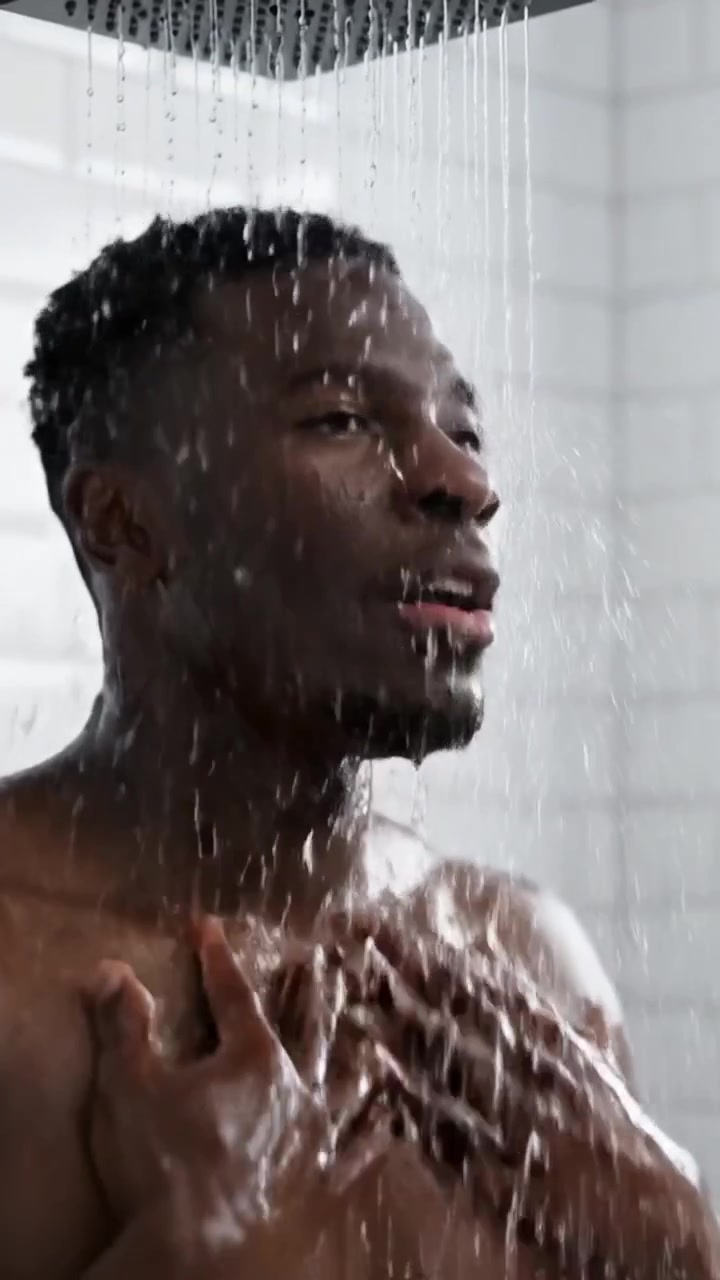A Refreshing Shower Experience: Capturing the Moment of Serenity and Relaxation Under the Flowing Water, Emphasizing Self-Care and Well-Being.