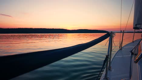 the front bow of a white sailing boat with blue sky and sea background