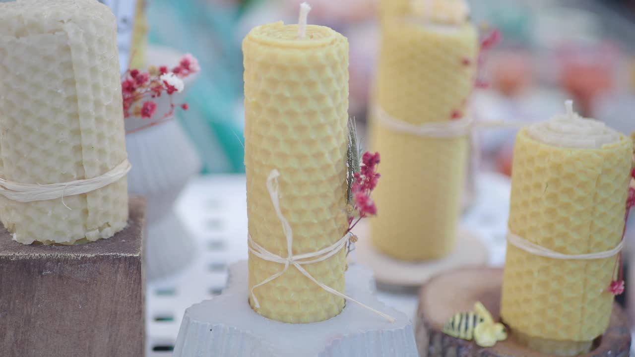 Honeycomb Candles Displayed at a Market