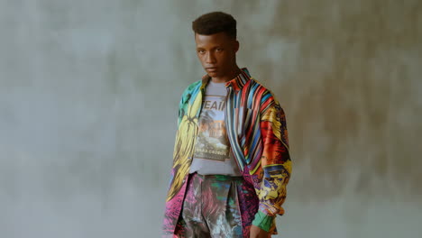 portrait of a young man in a vibrant, patterned shirt