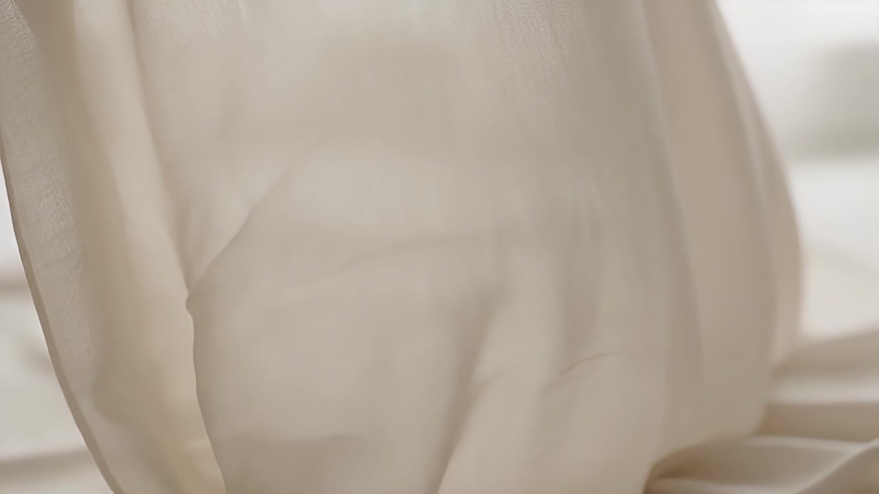 Soft White Curtain Blowing in the Breeze