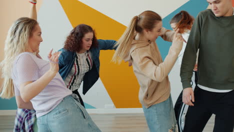 group of young women dancing in a studio