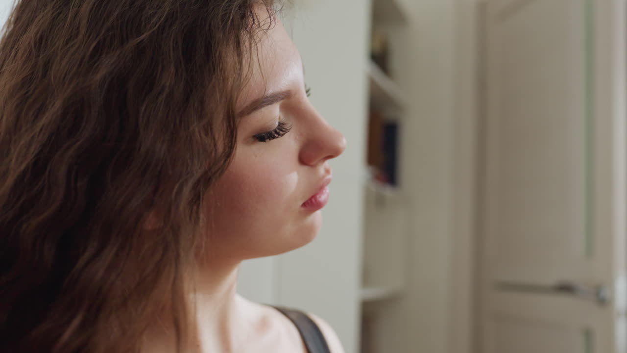 White Woman Serene Makeup Moment Profile, Slow Brush Movements Along Cheek And Lips, Eyes Closed In Calm, Soft Natural Tones, Subtle Contour And Lash Enhancement, Poised Model Energy