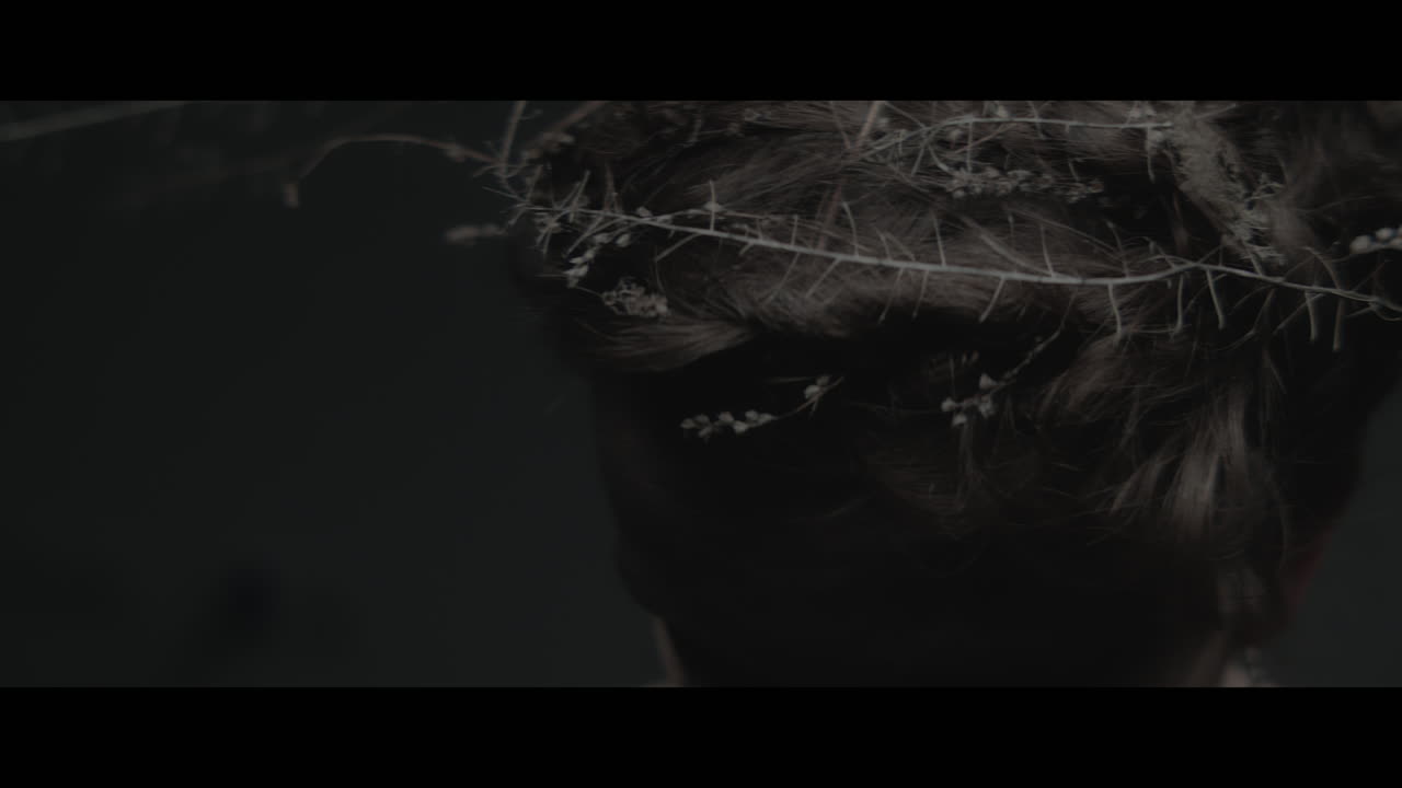 A woman dressed as mother nature shows her hair