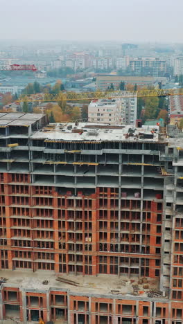 construction of a residential apartment complex. aerial view. vertical video