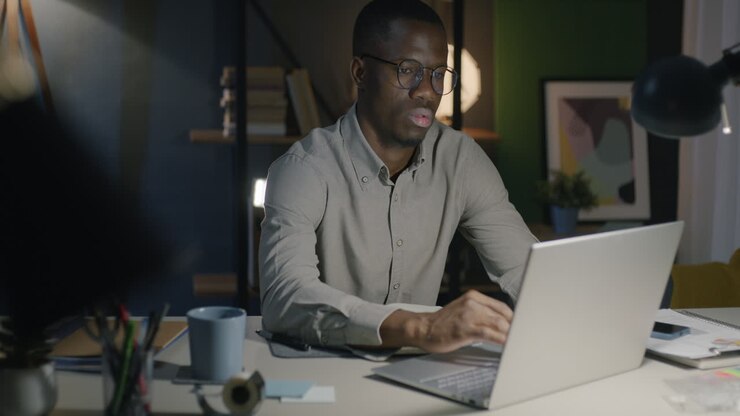 Man working late at night on laptop