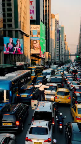 traffic police officer directing heavy city traffic at rush hour
