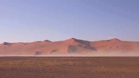 very strong winds blow sand during a sandstorm in namib naukluft national park namibia