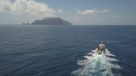 aerial ship motors toward island of capri in