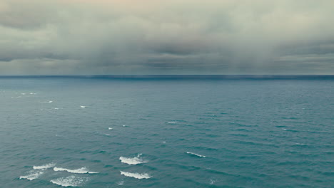 drone pan from small village to lake superior