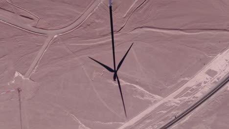 aerial view around wind turbines with a dramatic sky at a desert in chile