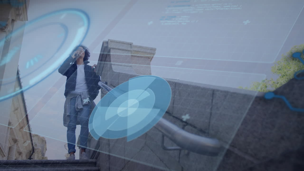 Man on stone steps calling on smartphone, showcasing blue digital interface graphics for technology