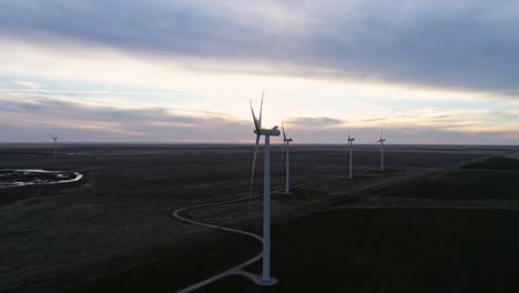 Granja-De-Energía-Eólica-Turbinas-Energía-Limpia-Alternativa-Molinos-De-Viento-Puesta-De-Sol