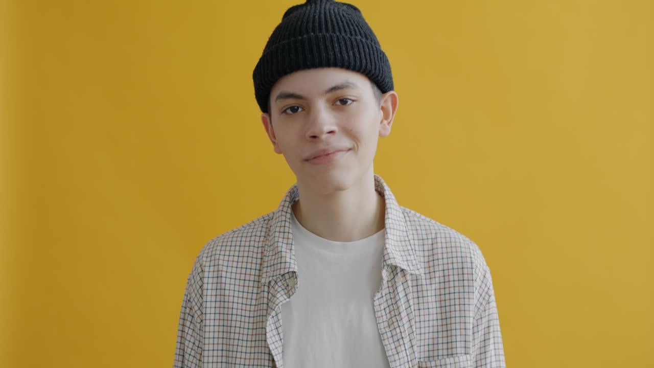 Young Man in Plaid Shirt and Beanie