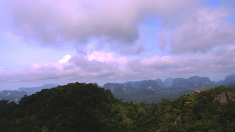 looking at the clouds and mountain.